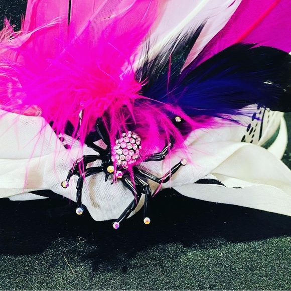 This was a plain felt fedora. The studs are metal and screwed in individually. - Picture 2 of 5